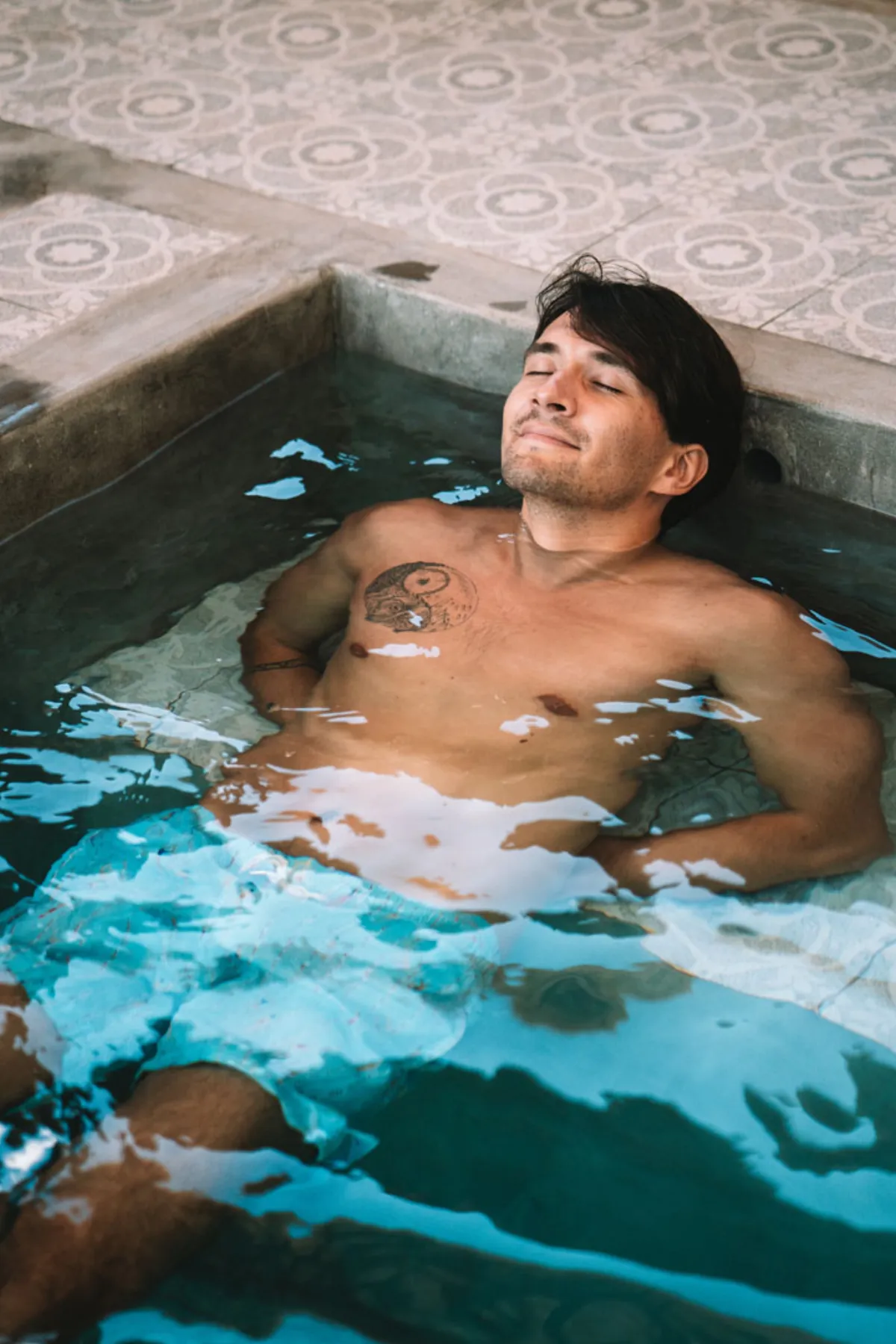 Guest relaxing plunge pool Hesa Ubud