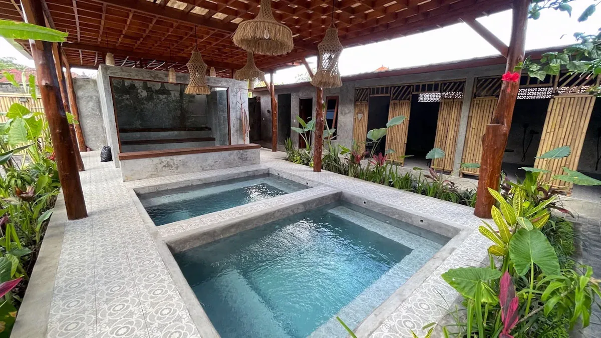 Hesa Spa Sandat plunge pools side view with bamboo treatment rooms, Ubud Bali