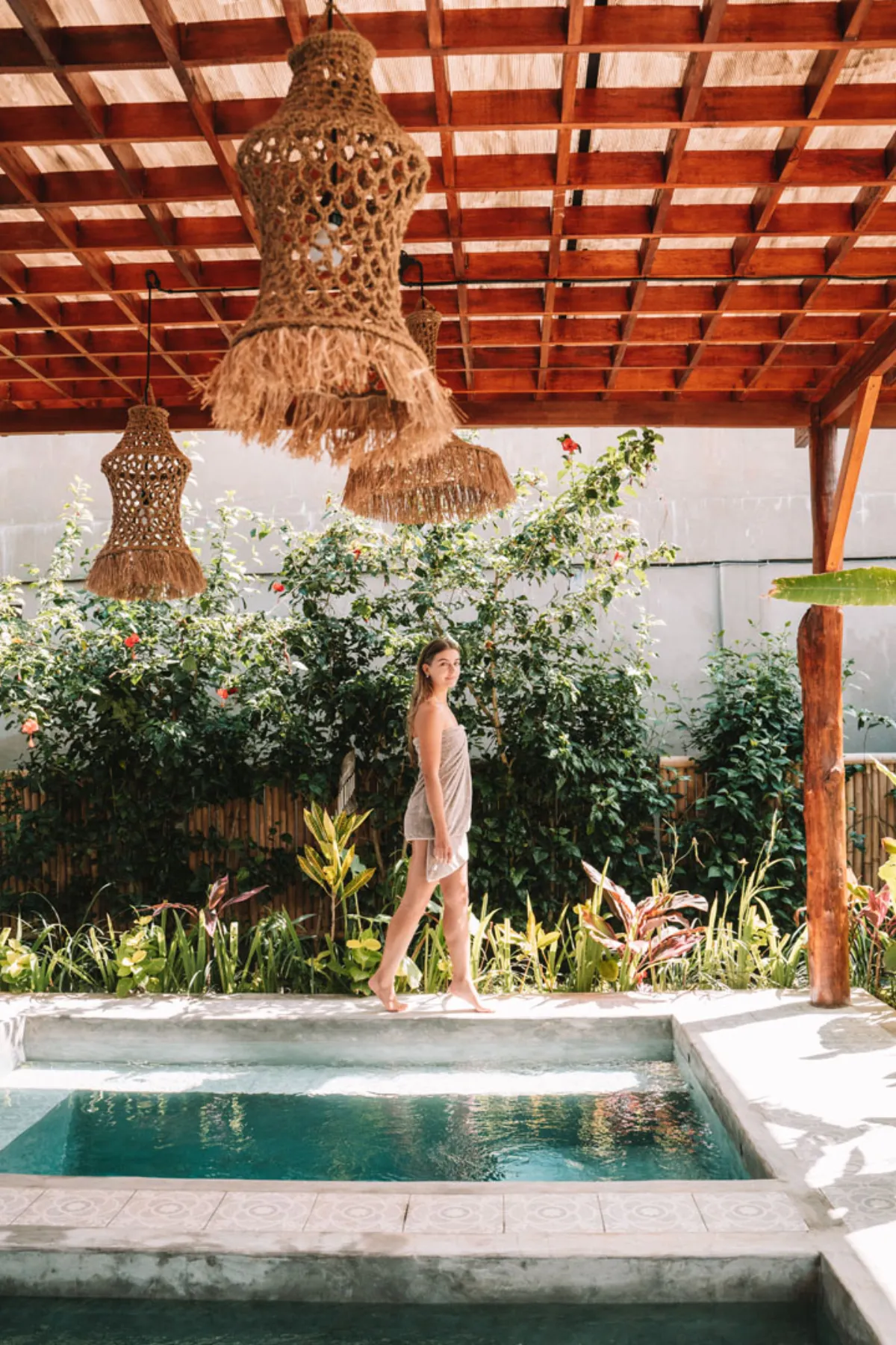 Hesa Spa Sandat pool pergola with hanging rattan lantern and lush garden, Ubud Bali